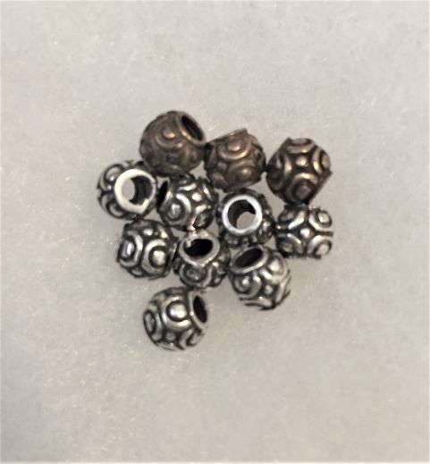 1483  BEAD, Small, embossed design. appx. 1/8"